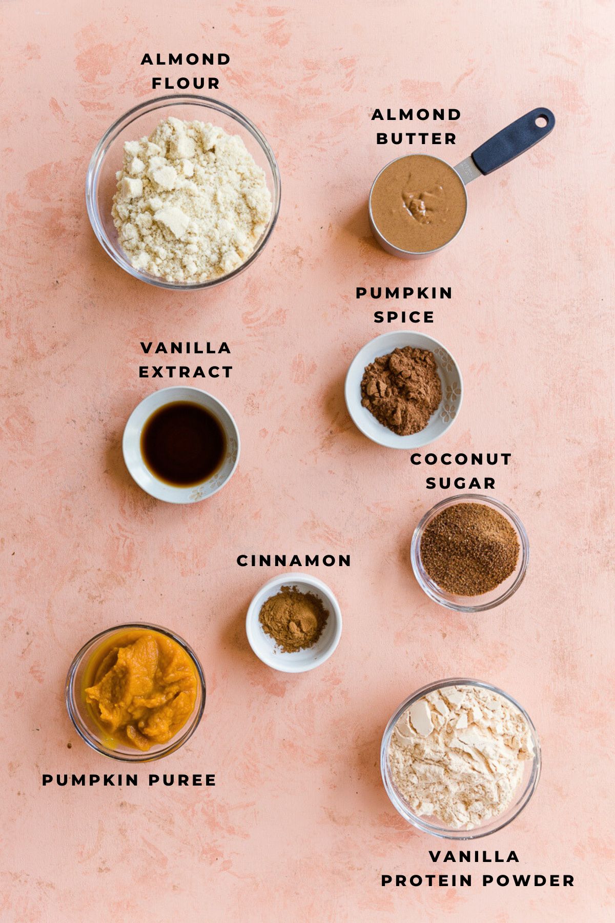 Ingredients for pumpkin protein bars measured out in small bowls.