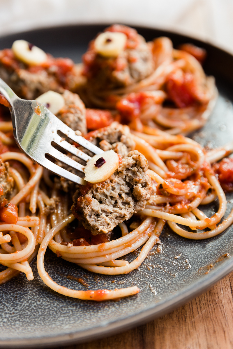 Meatball with a bite taken out.