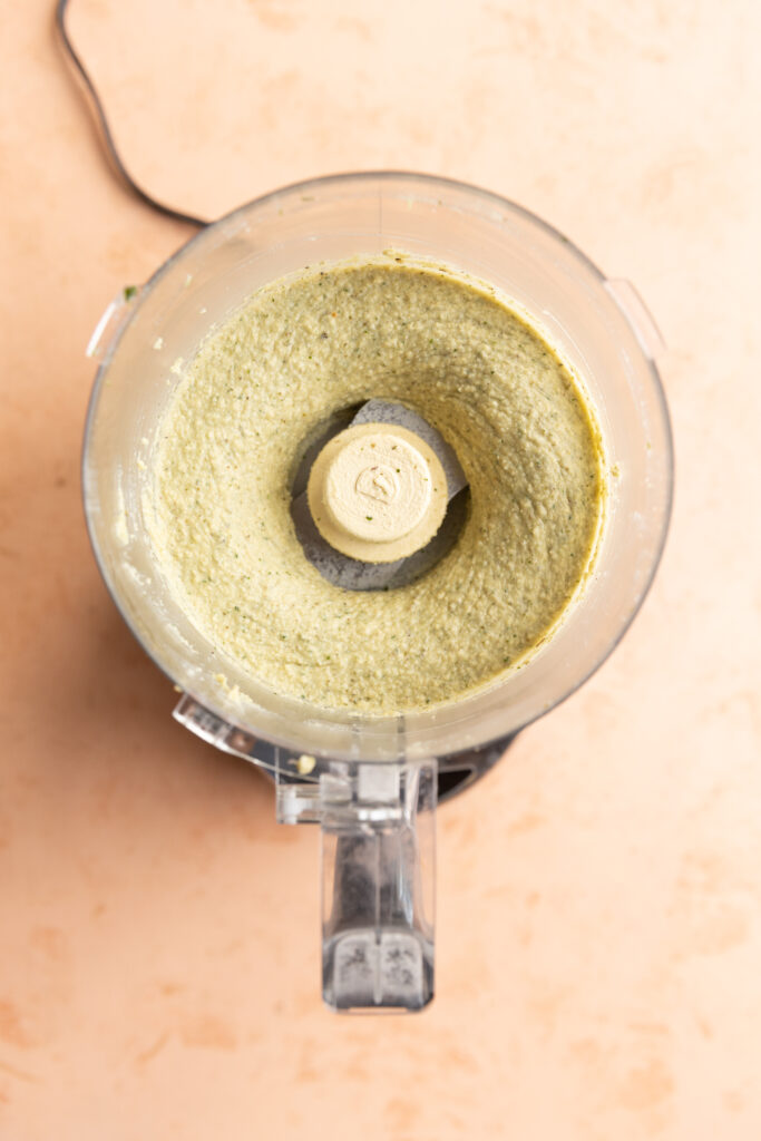 Creamy cheese ball filling in food processor.