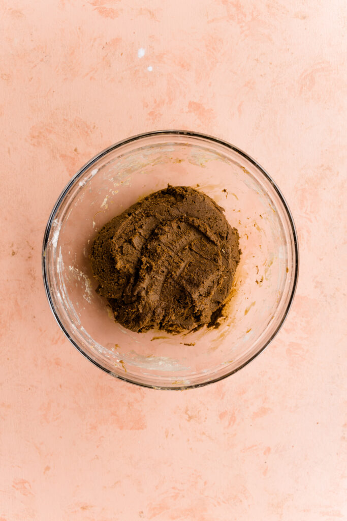 Gingerbread cut out cookie dough in a bowl.