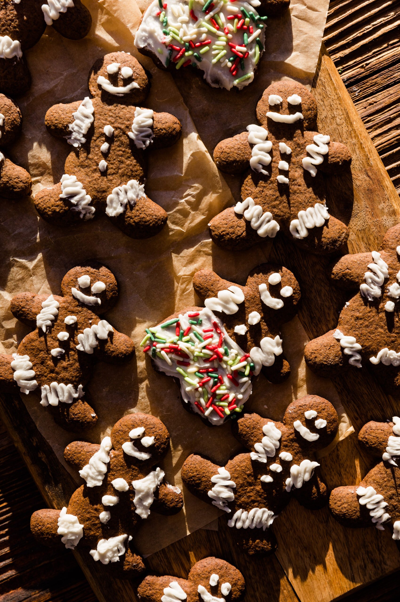 Gingerbread cookies decorated with frosting like gingerbread men and women.
