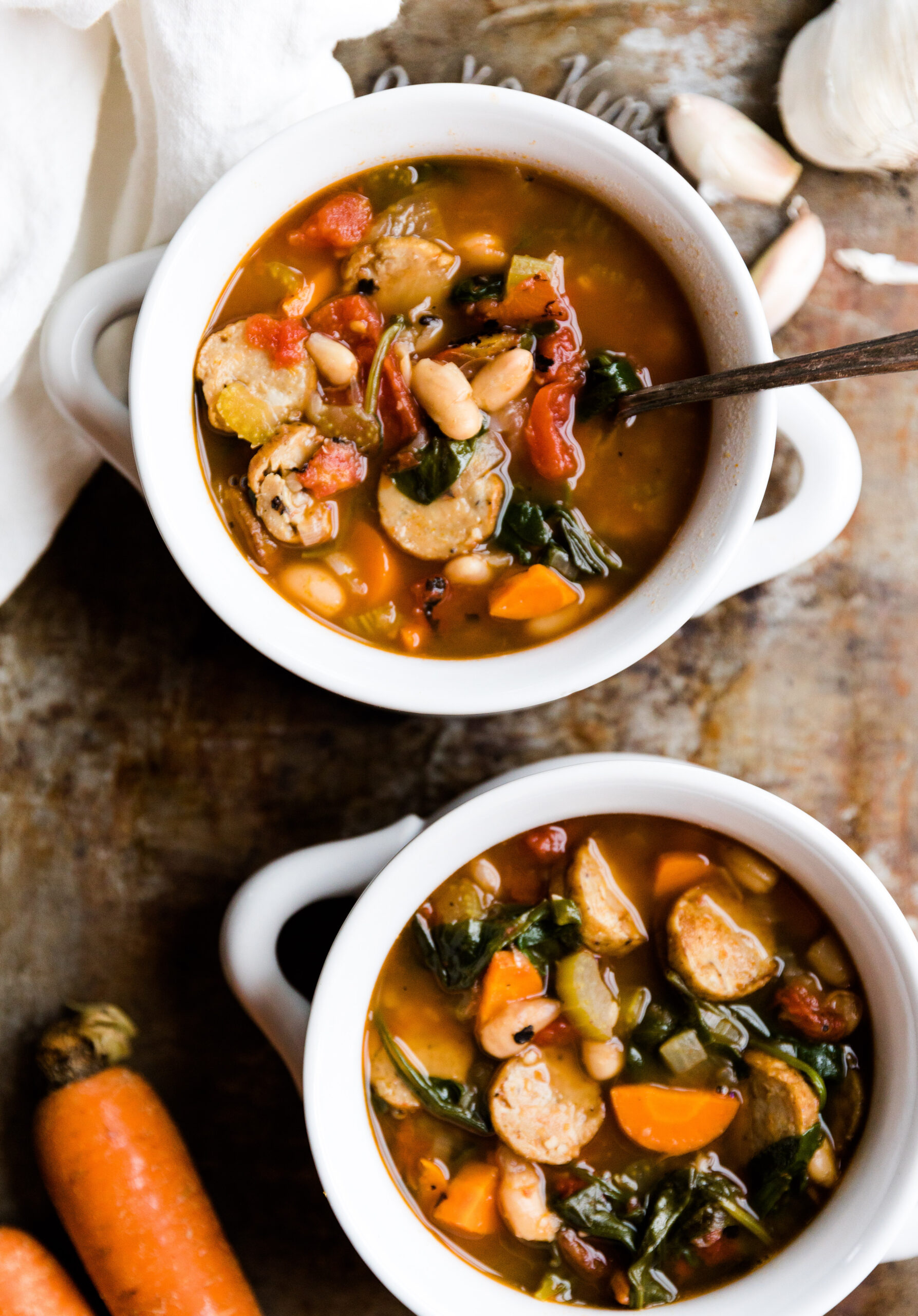 Two bowls of chicken sausage soup.