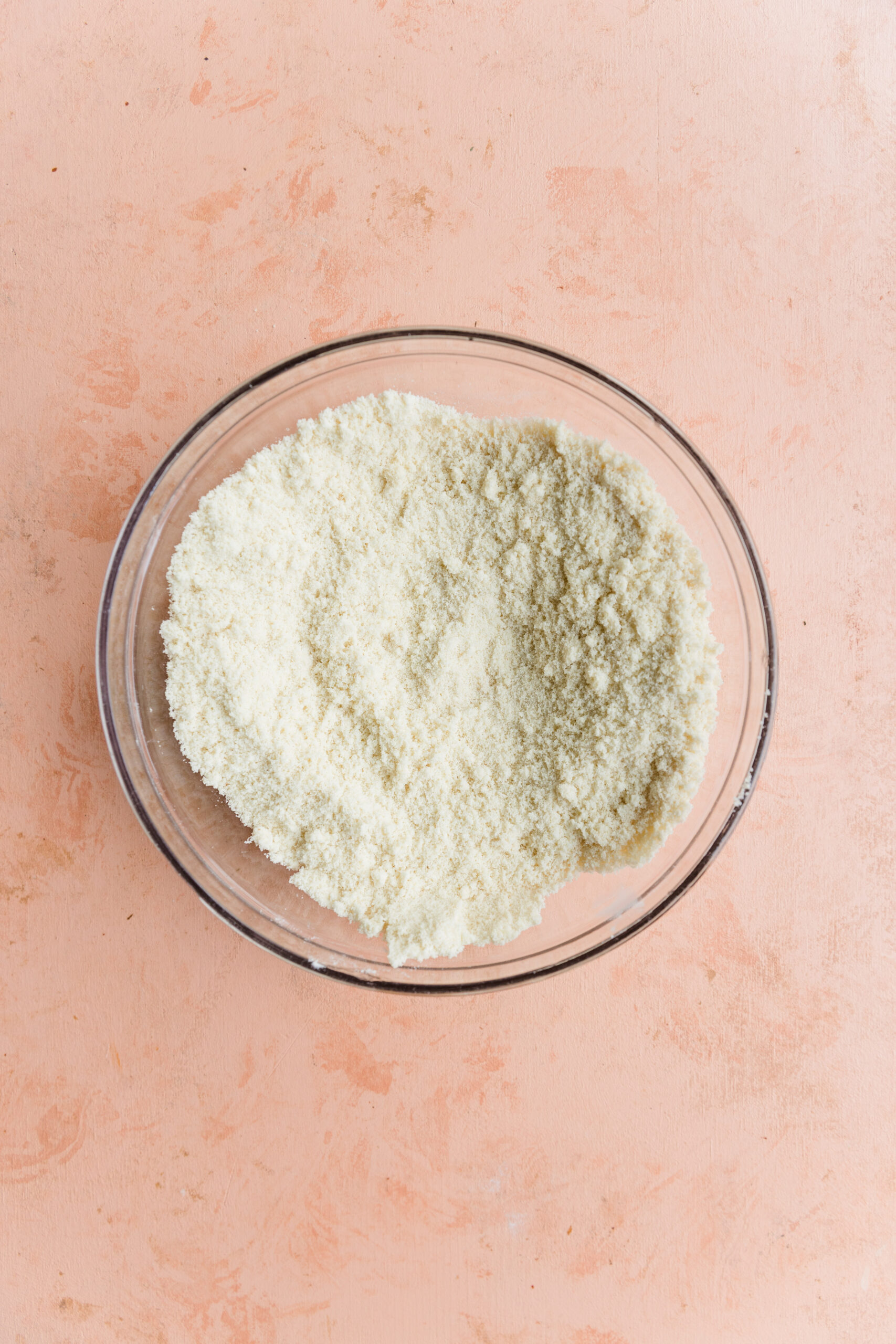 Dry ingredients in glass mixing bowl.