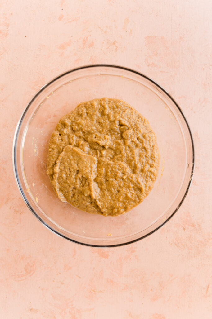 Banana bread batter in a mixing bowl.