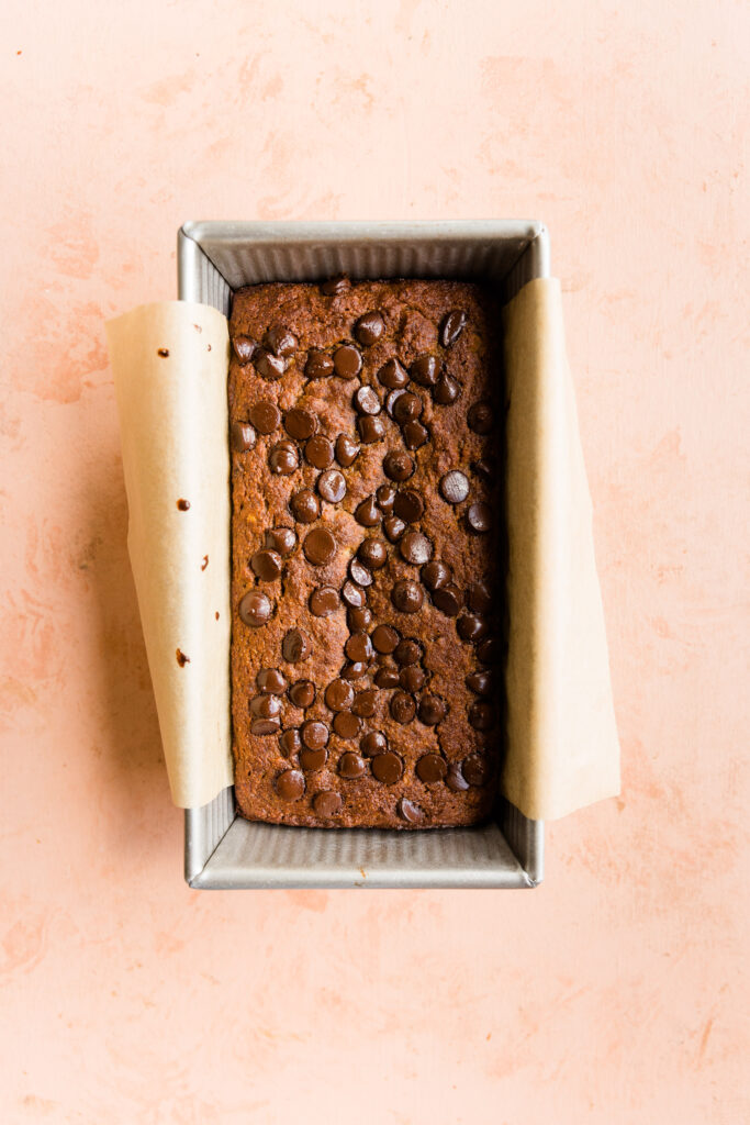 Baked banana bread in a loaf pan.