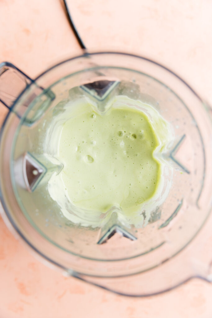 Creamy green shamrock shake in vitamix blender.