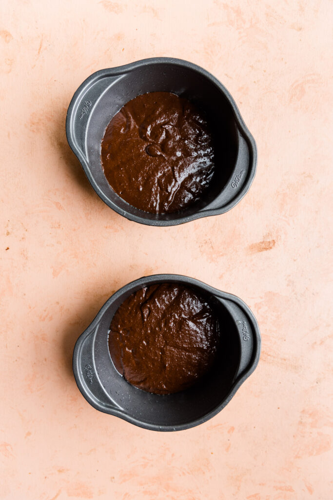 Cake batter in two 5-inch cake pans.