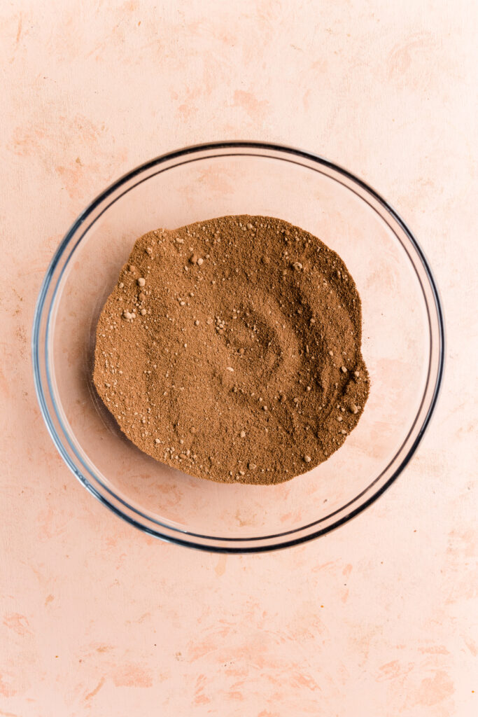 Dry ingredients in a glass mixing bowl.