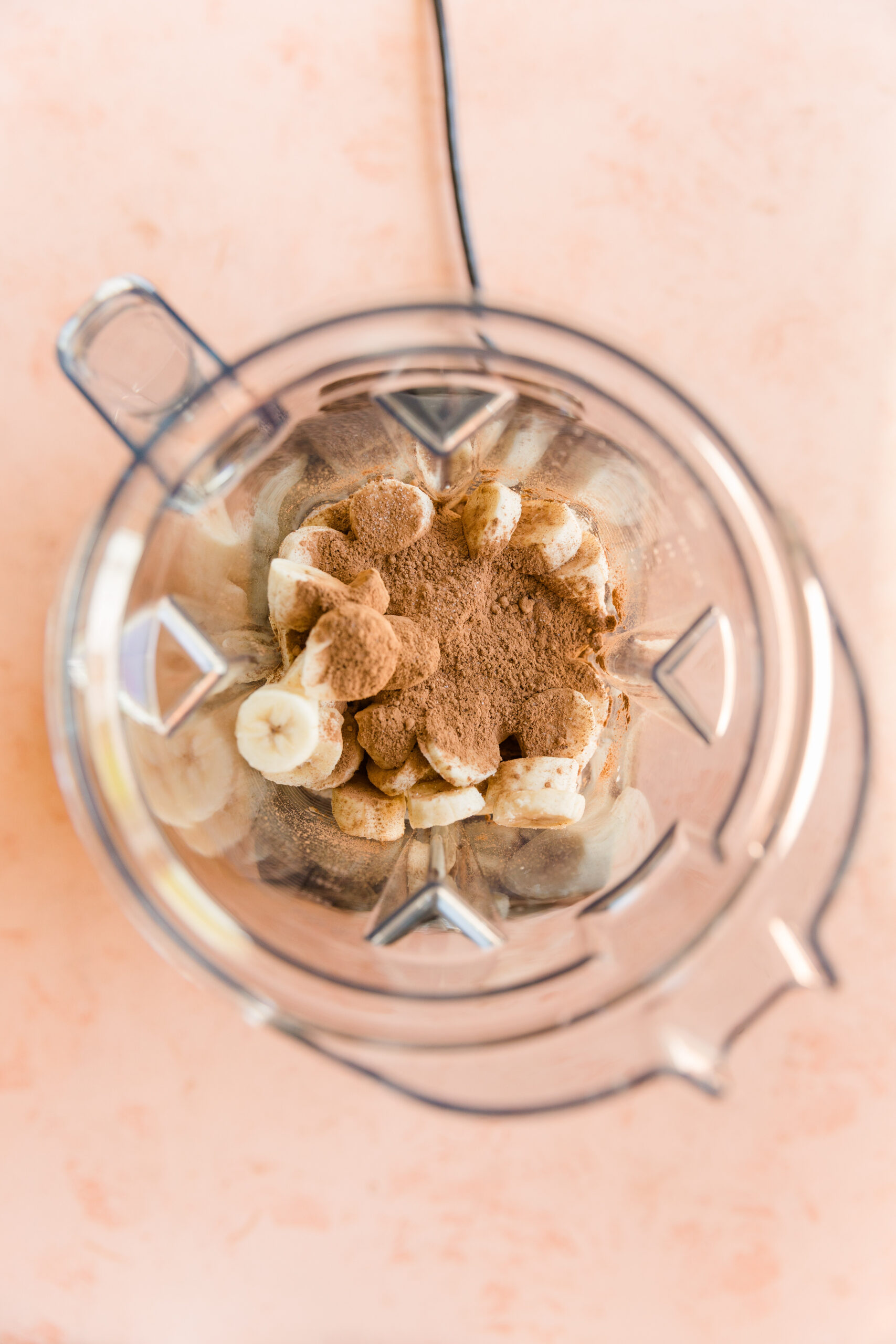 Ingredients for chocolate nice cream in blender.