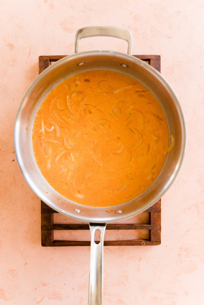 Curry broth in large skillet with onions.