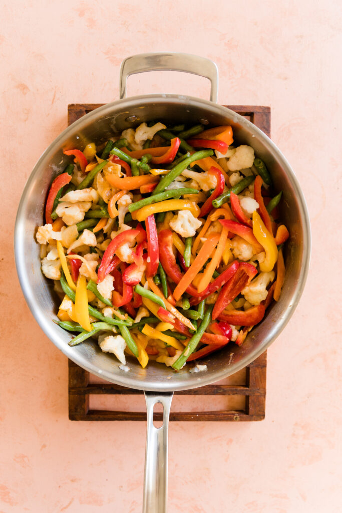 Vegetables in large skillet with broth.