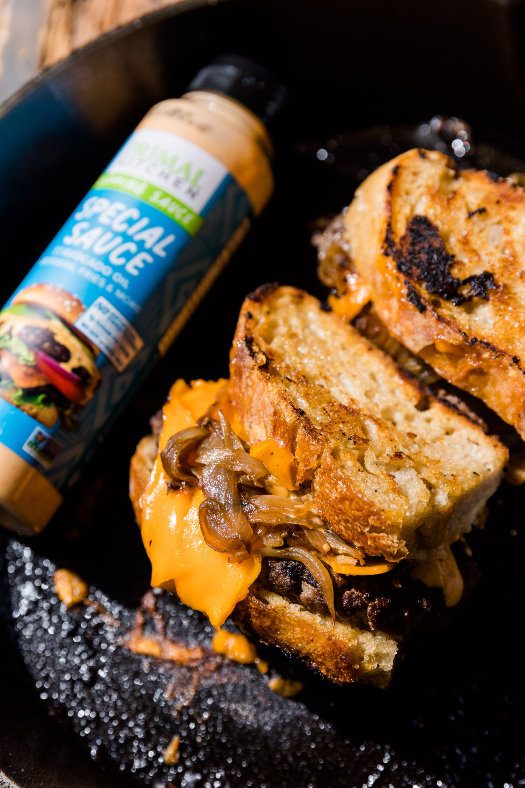 Patty melt with cheese and toasted bread.
