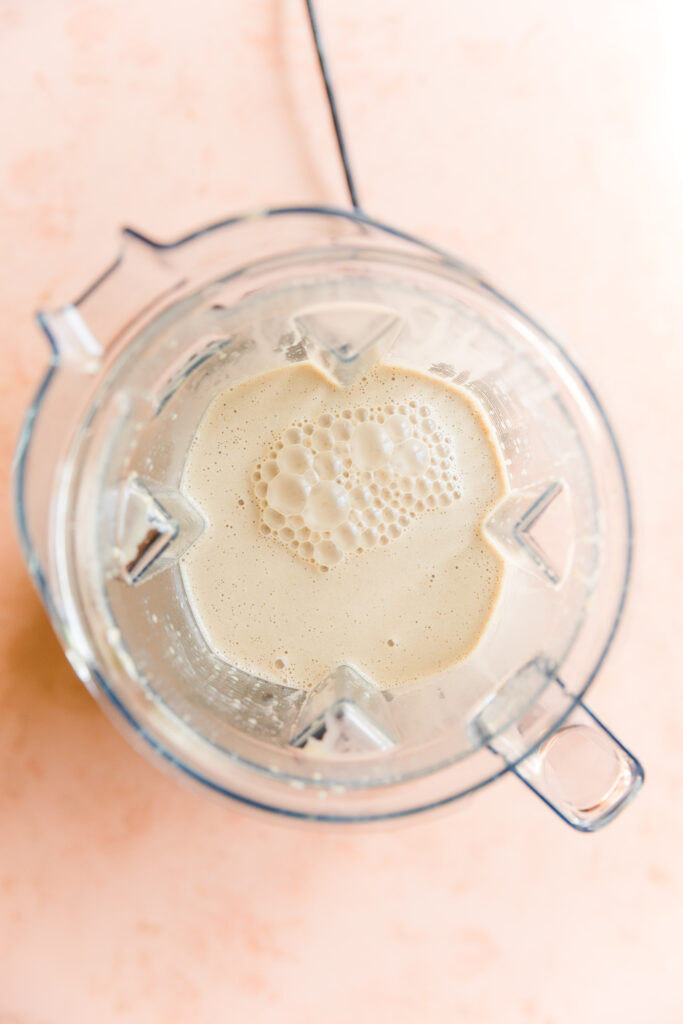 Coconut ice cream mixture in blender.