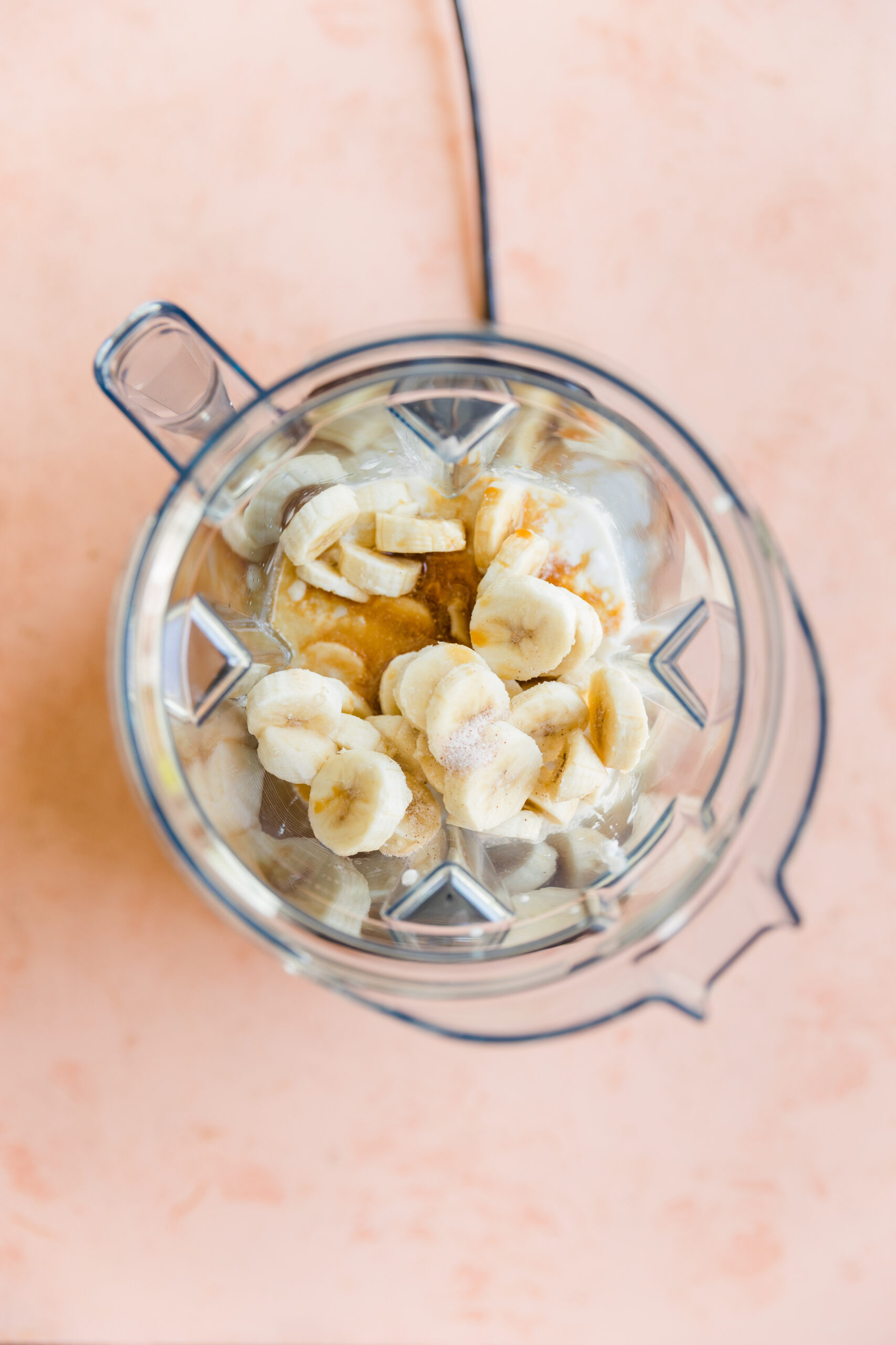 Coconut milk, frozen bananas, vanilla extract, and salt in a blender.