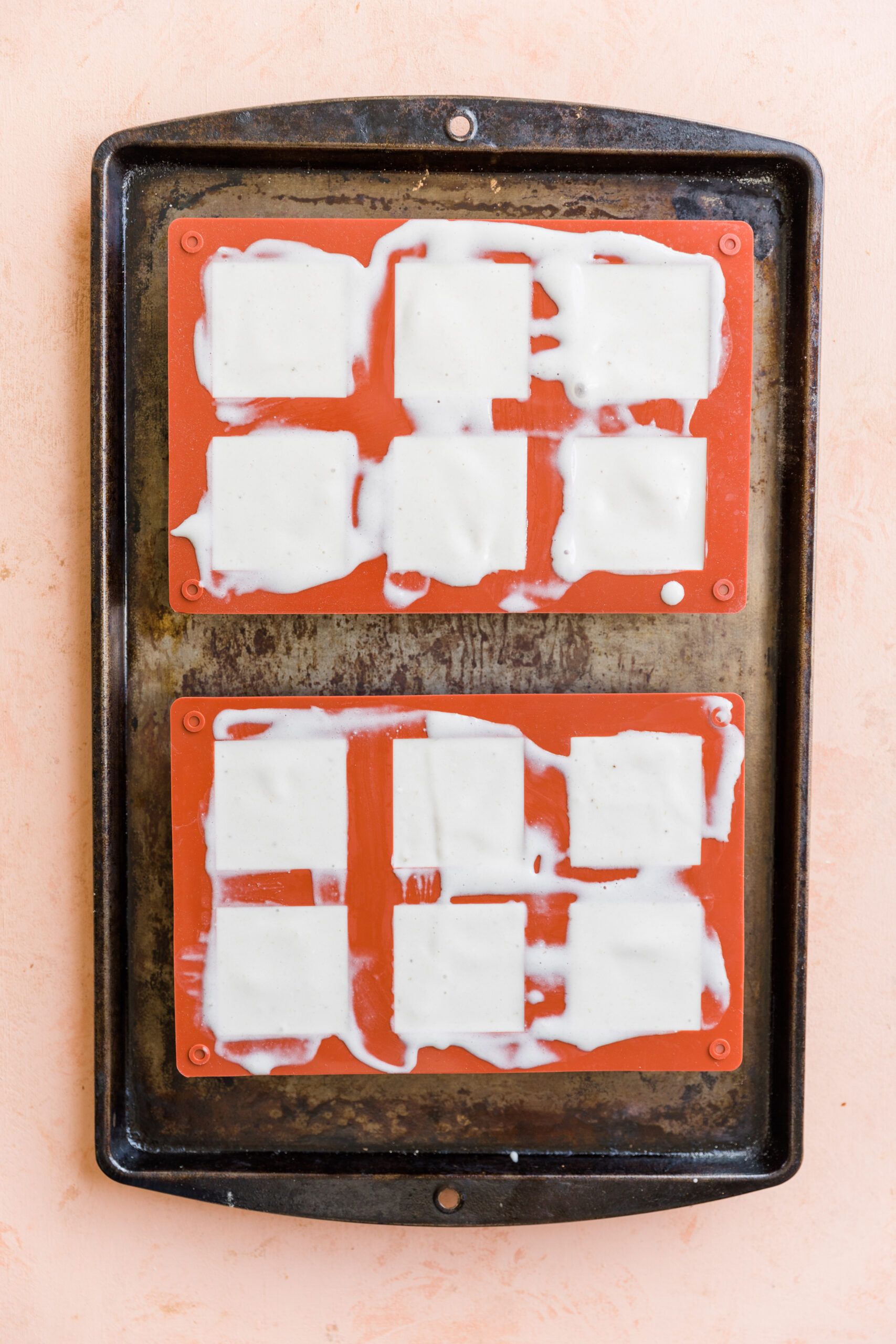 Dairy free vanilla ice cream in square silicone molds.
