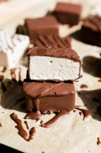Half of a dairy free Klondike bar stacked on top of another.