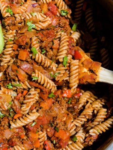 Spoon scooping taco pasta.