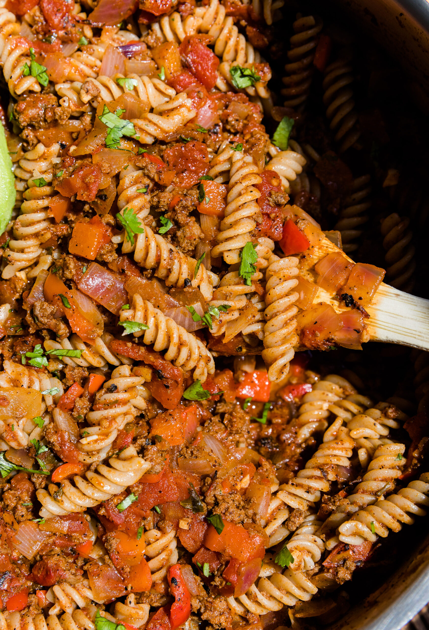 Spoon scooping taco pasta.
