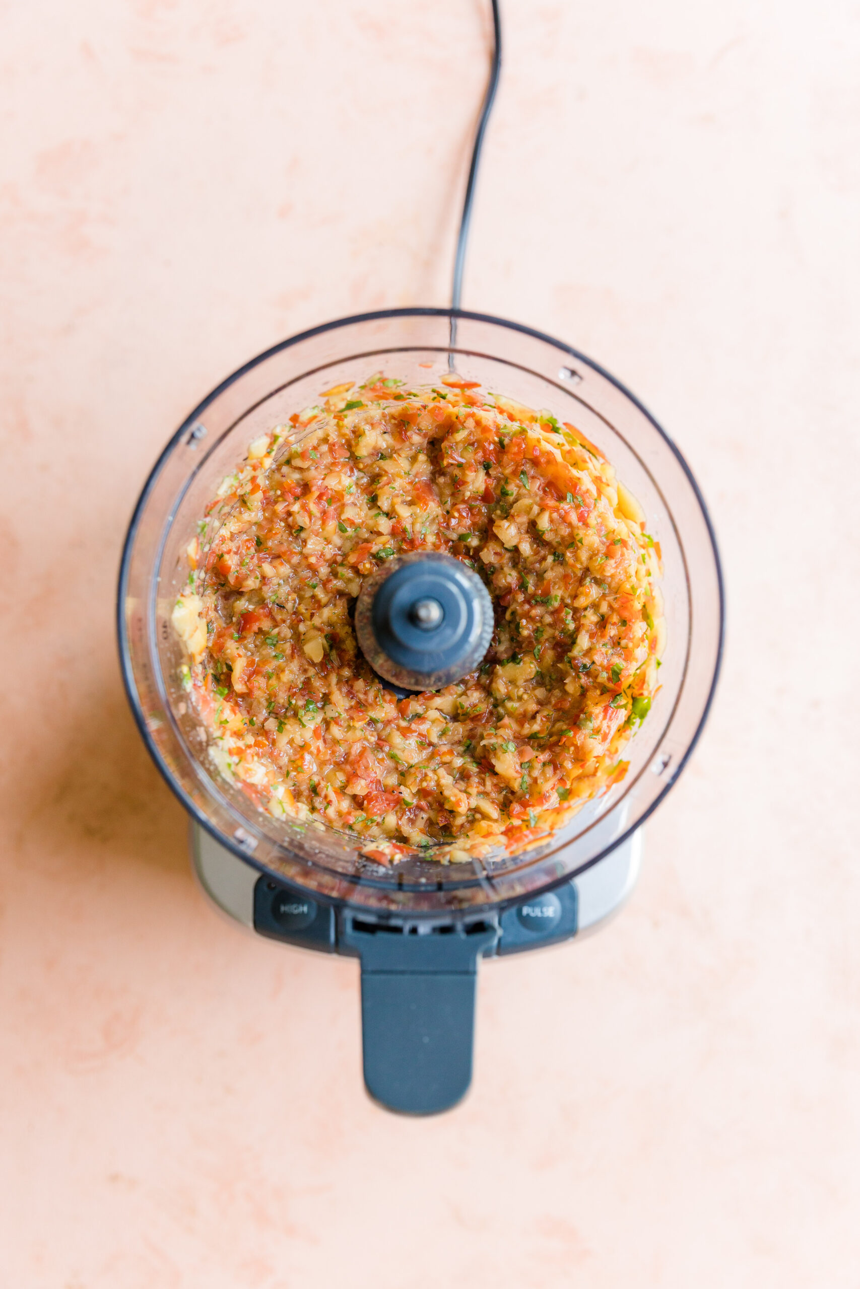 Chunky peach salsa in food processor.