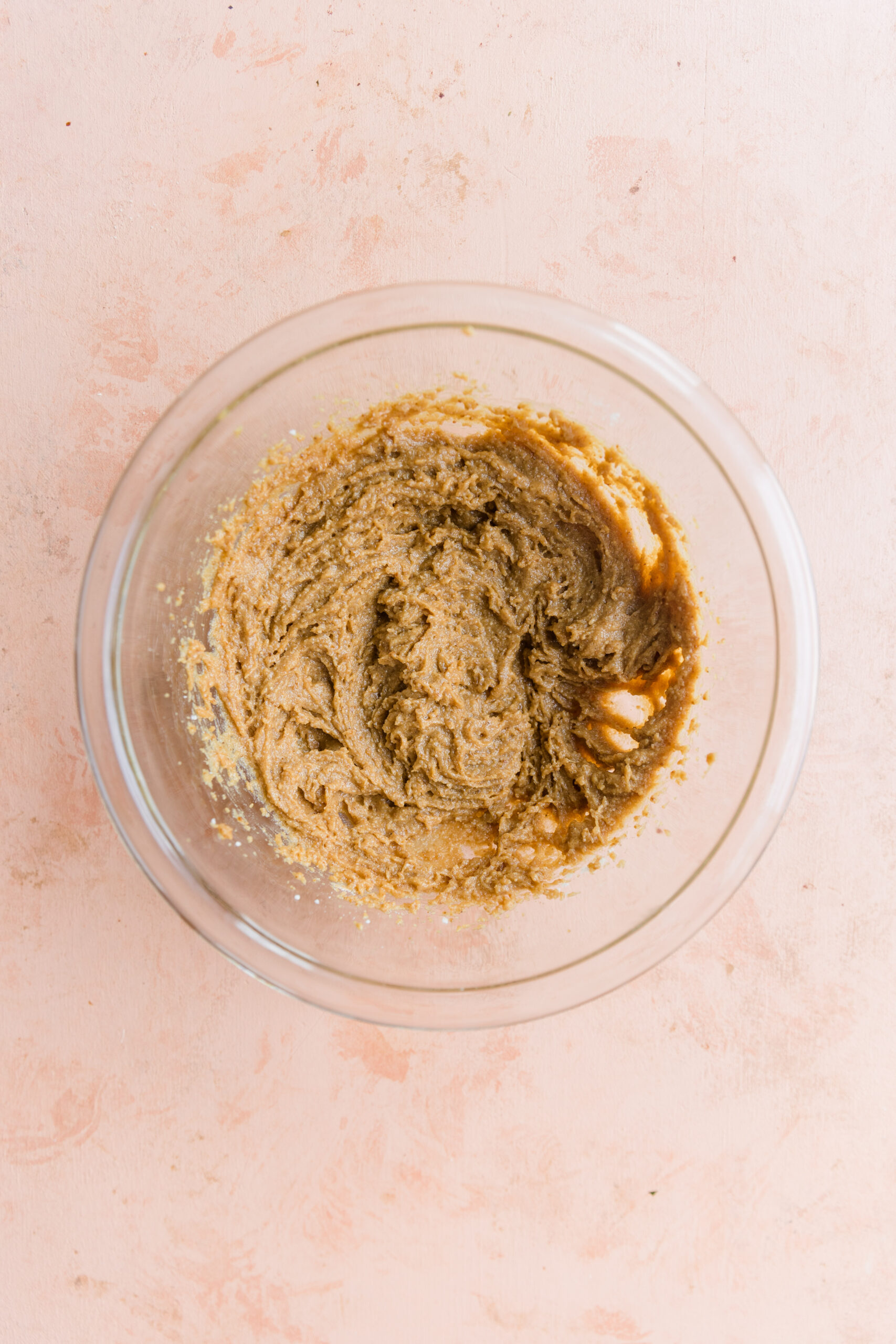 Edible sugar cookie dough mixed in bowl.
