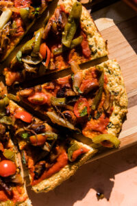 Close up picture of cauliflower pizza slice.