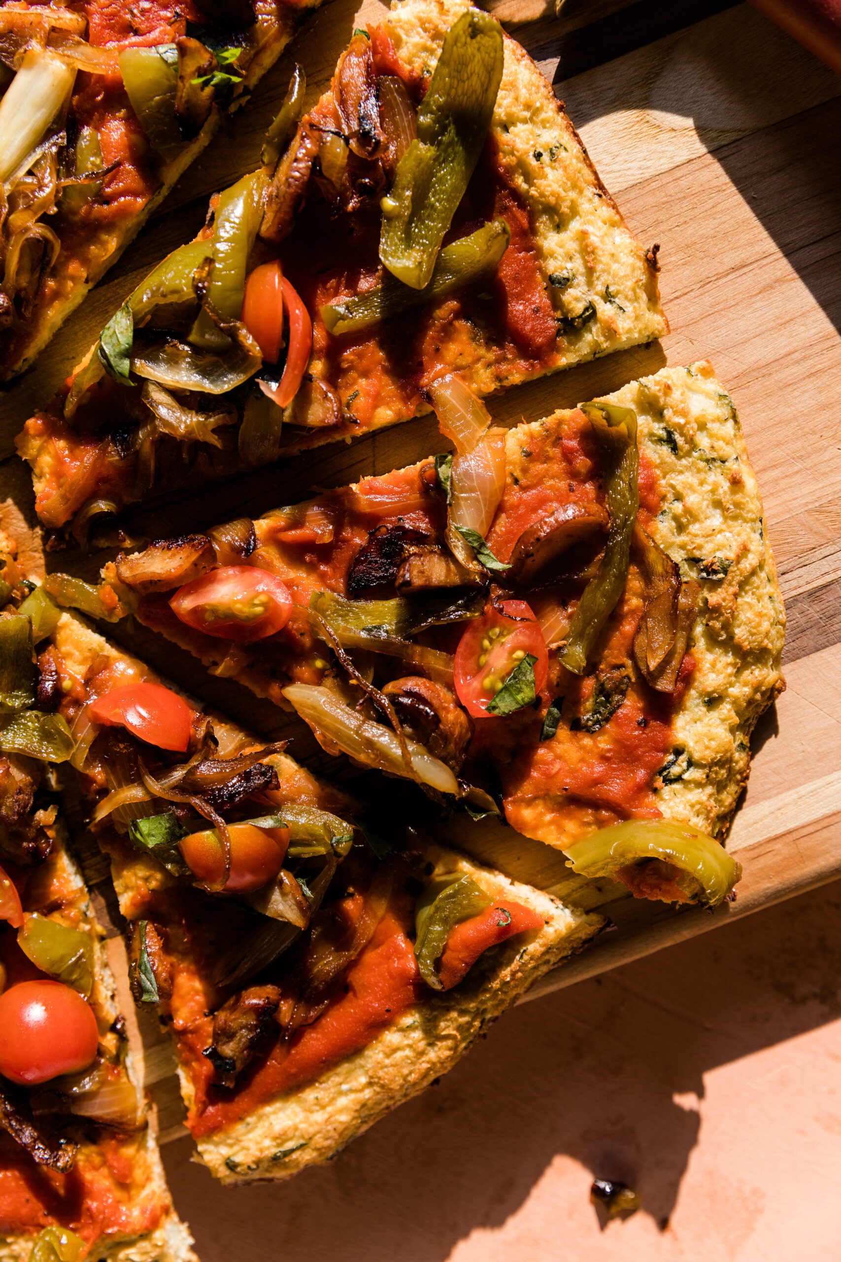 Close up picture of cauliflower pizza slice.