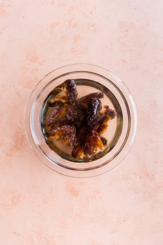 Medjool dates soaking in  water.
