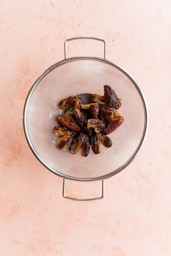 Soaked dates in strainer.