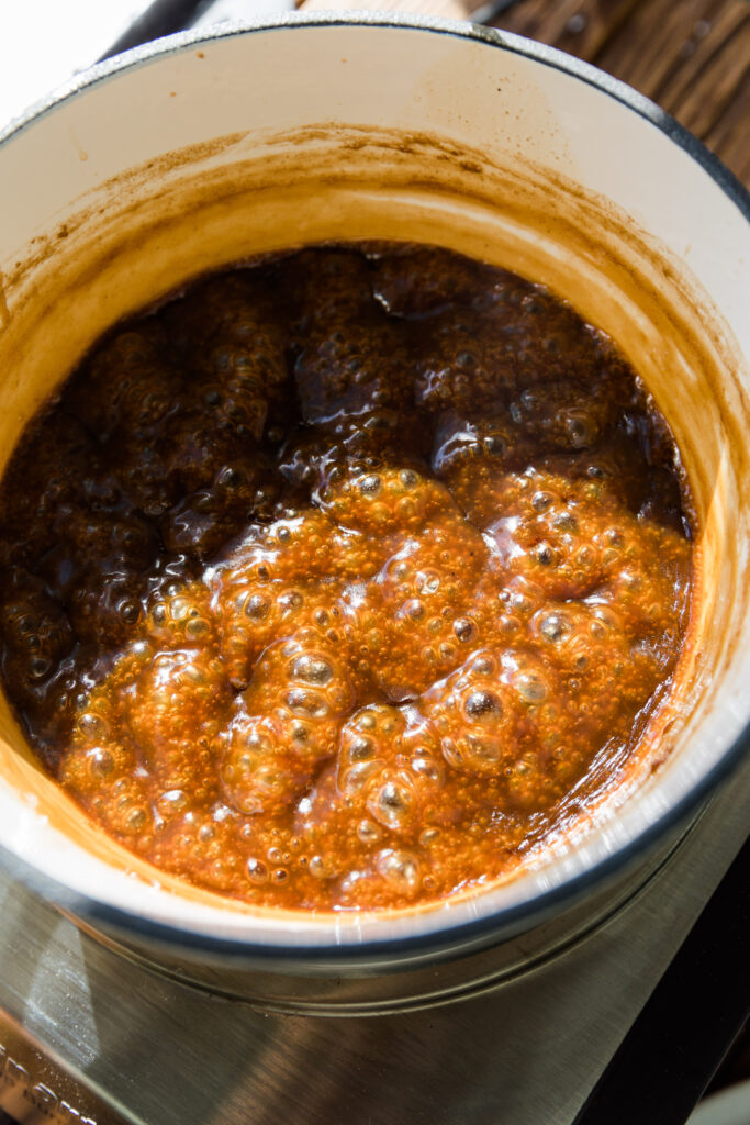 Dairy free caramel simmering in a pot.