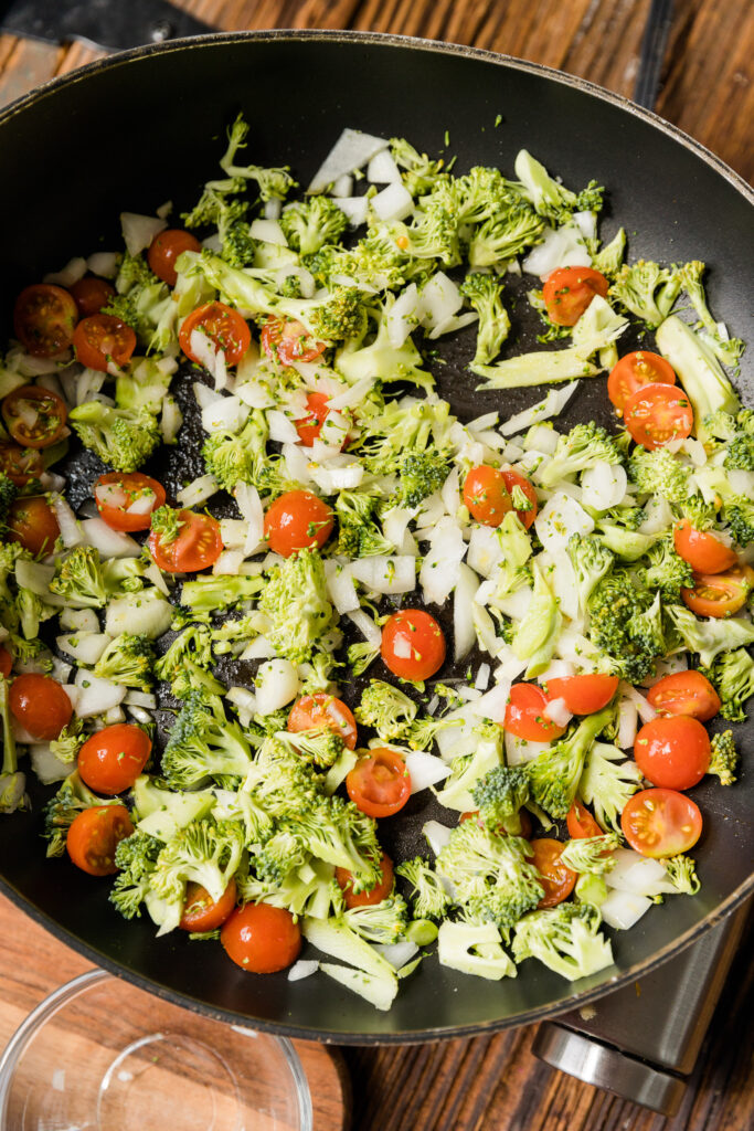 Vegetables cooking in a frying pan.