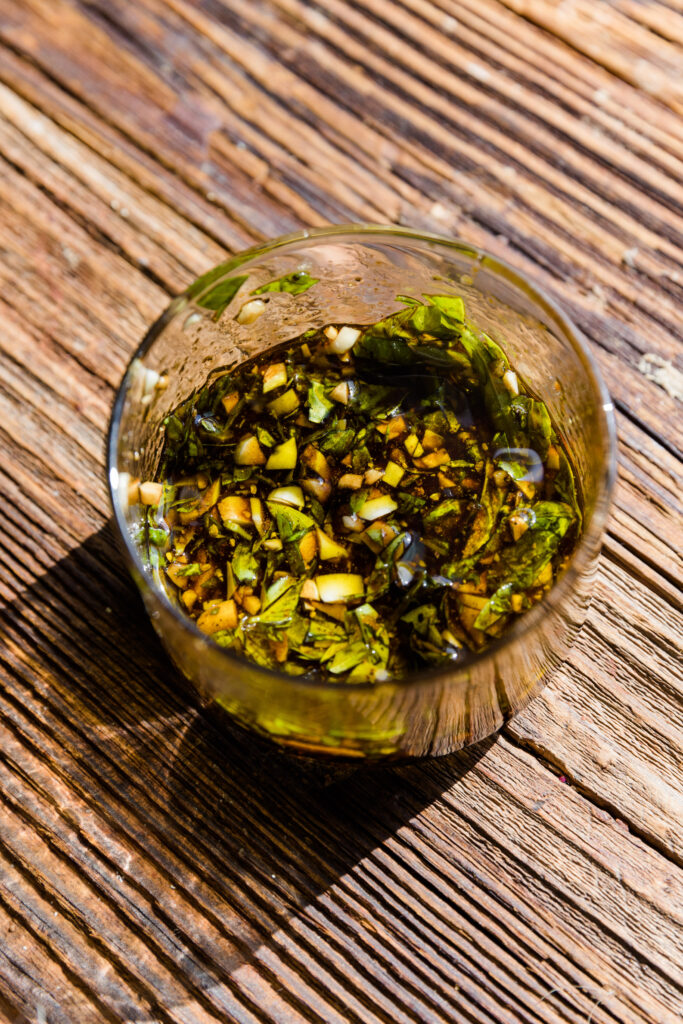 Simple balsamic dressing in glass jar.