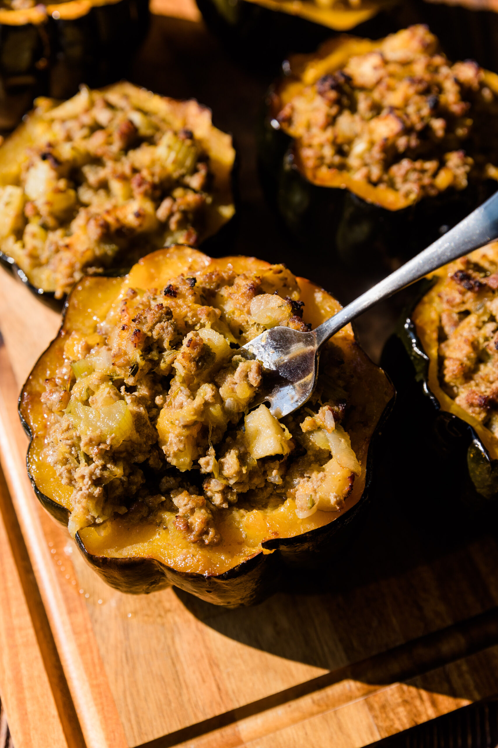 Fork scooping out a bite of the stuffed acorn squash.