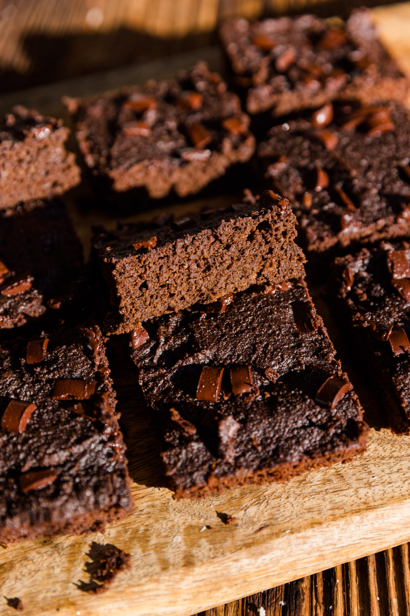 Almond flour brownies stacked on top of each other.