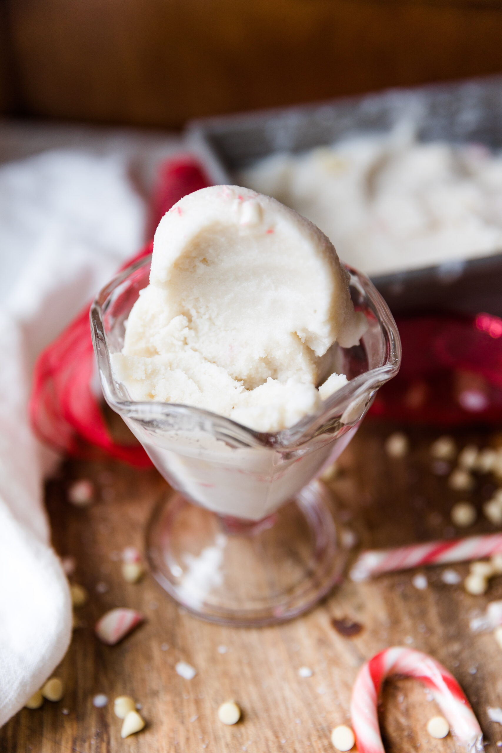 Peppermint ice cream scooped into a glass ice cream cup.