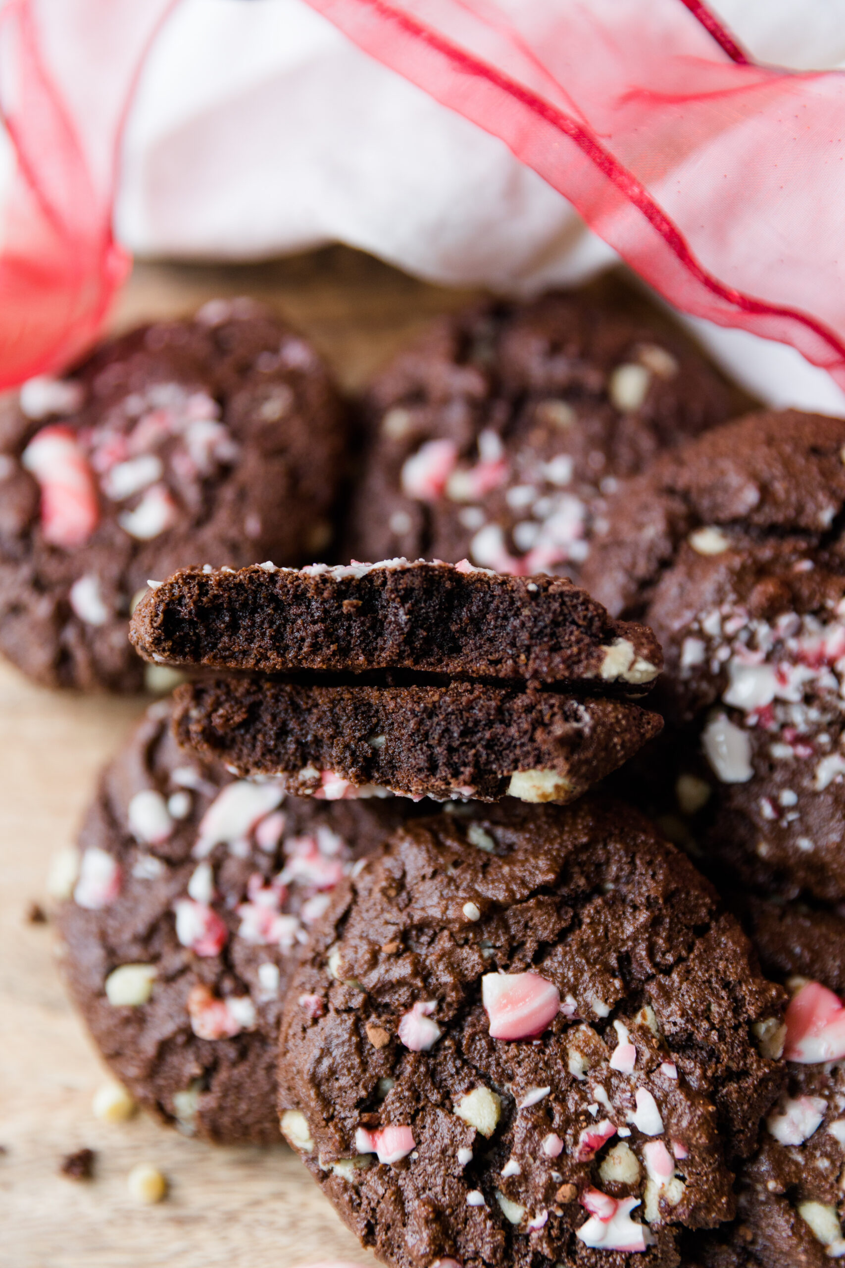 Chocolate peppermint cookies broken in half so you can see the soft inside.