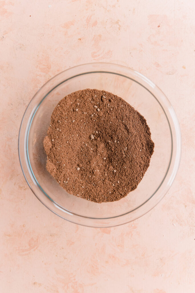 Dry ingredients in a glass mixing bowl.