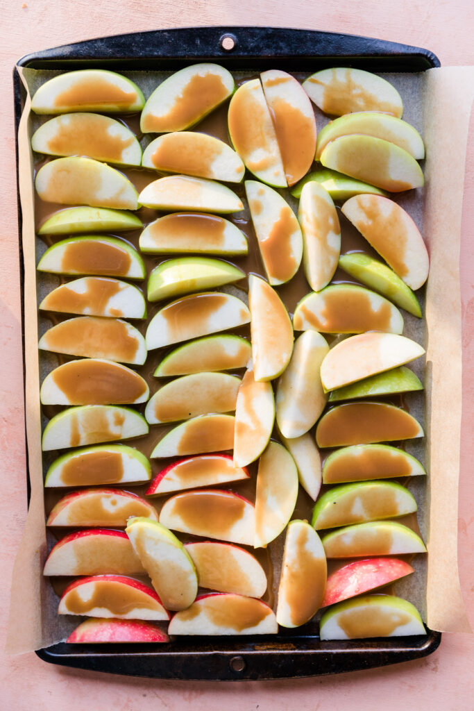Apple slices covered in dairy free caramel sauce.