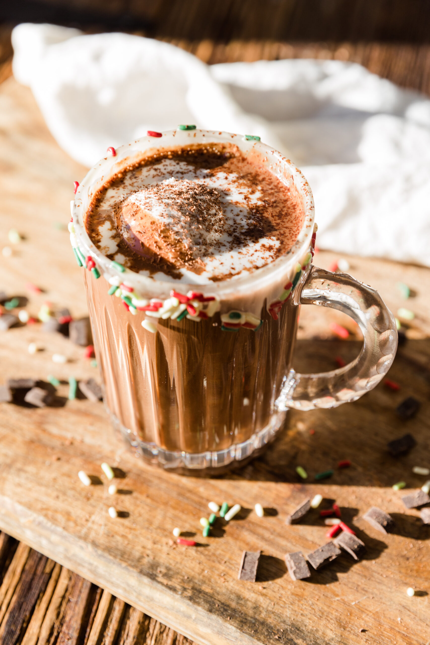 Vegan hot chocolate with coconut whipped cream and shaved chocolate on top.