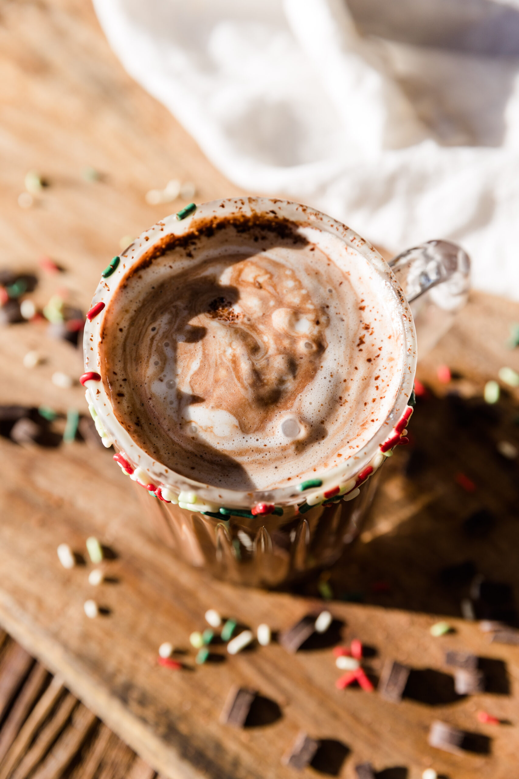 Overhead picture of dairy free hot chocolate with coconut cream swirled on top.
