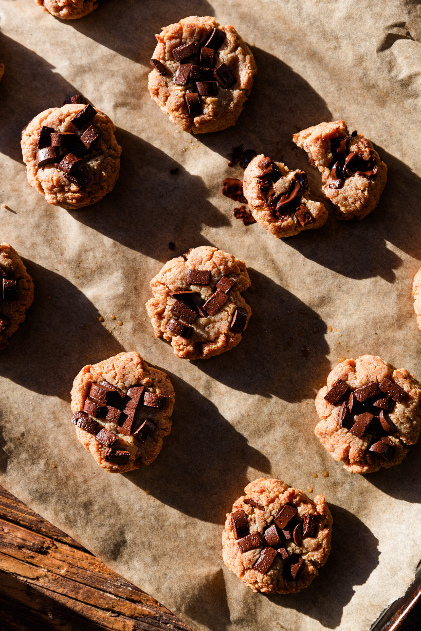 Almond flour chocolate chip cookies on parchment paper.