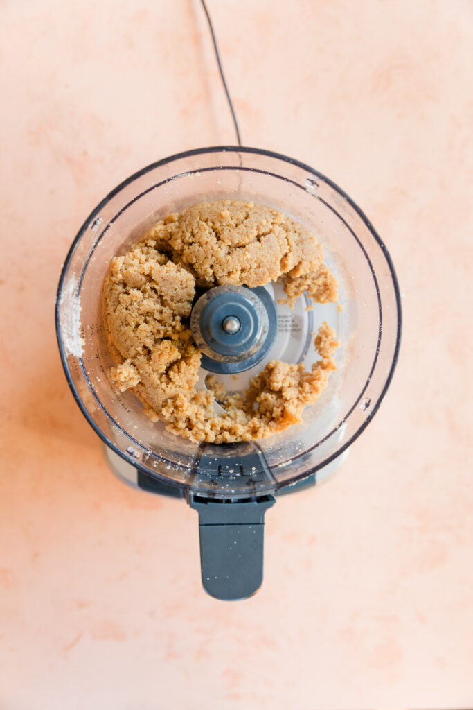 3 ingredient almond flour cookie dough in food processor.