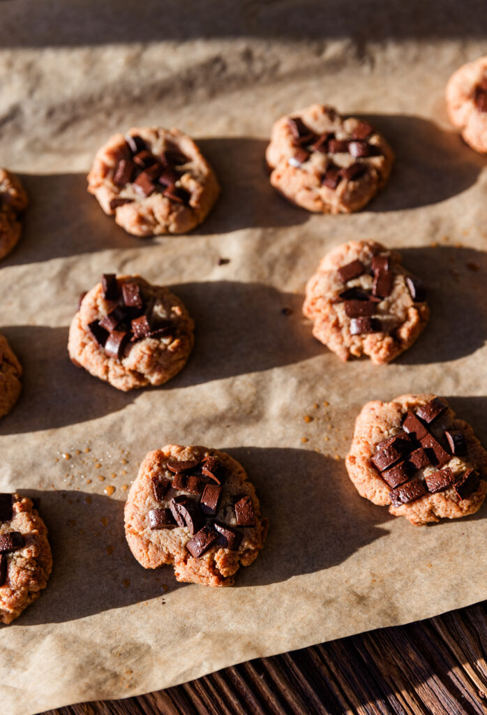 Golden brown almond flour cookies on baking sheet.